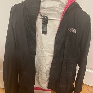 Northface rain jacket size small. Black with pink lining